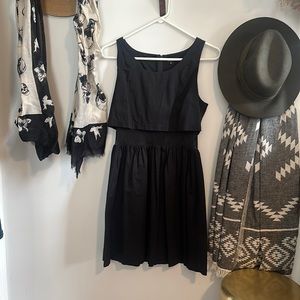 Black Tallulah skater dress with mesh midsection. 4